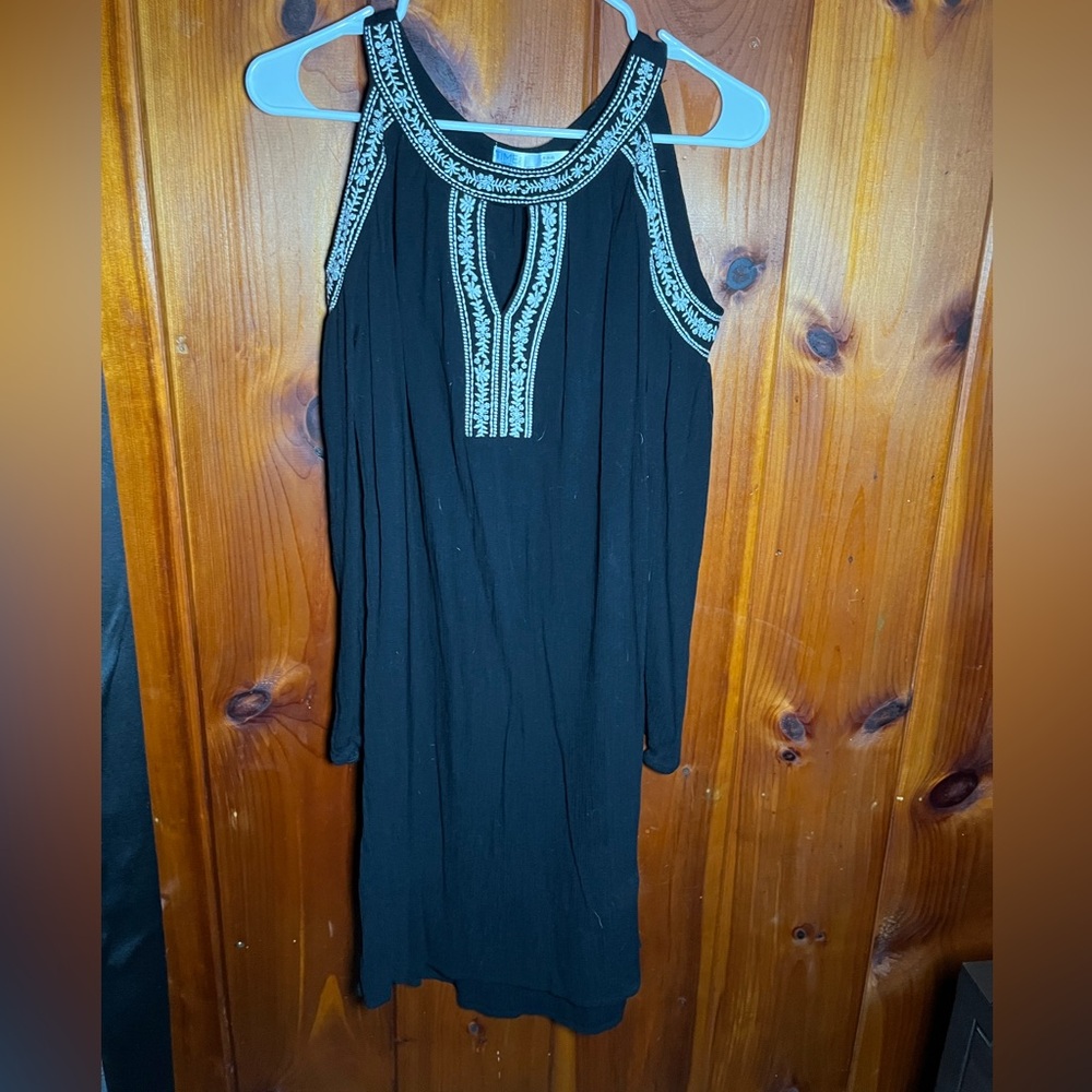 This black dress is stunning on has shoulder cut outs. Has been lightly worn.